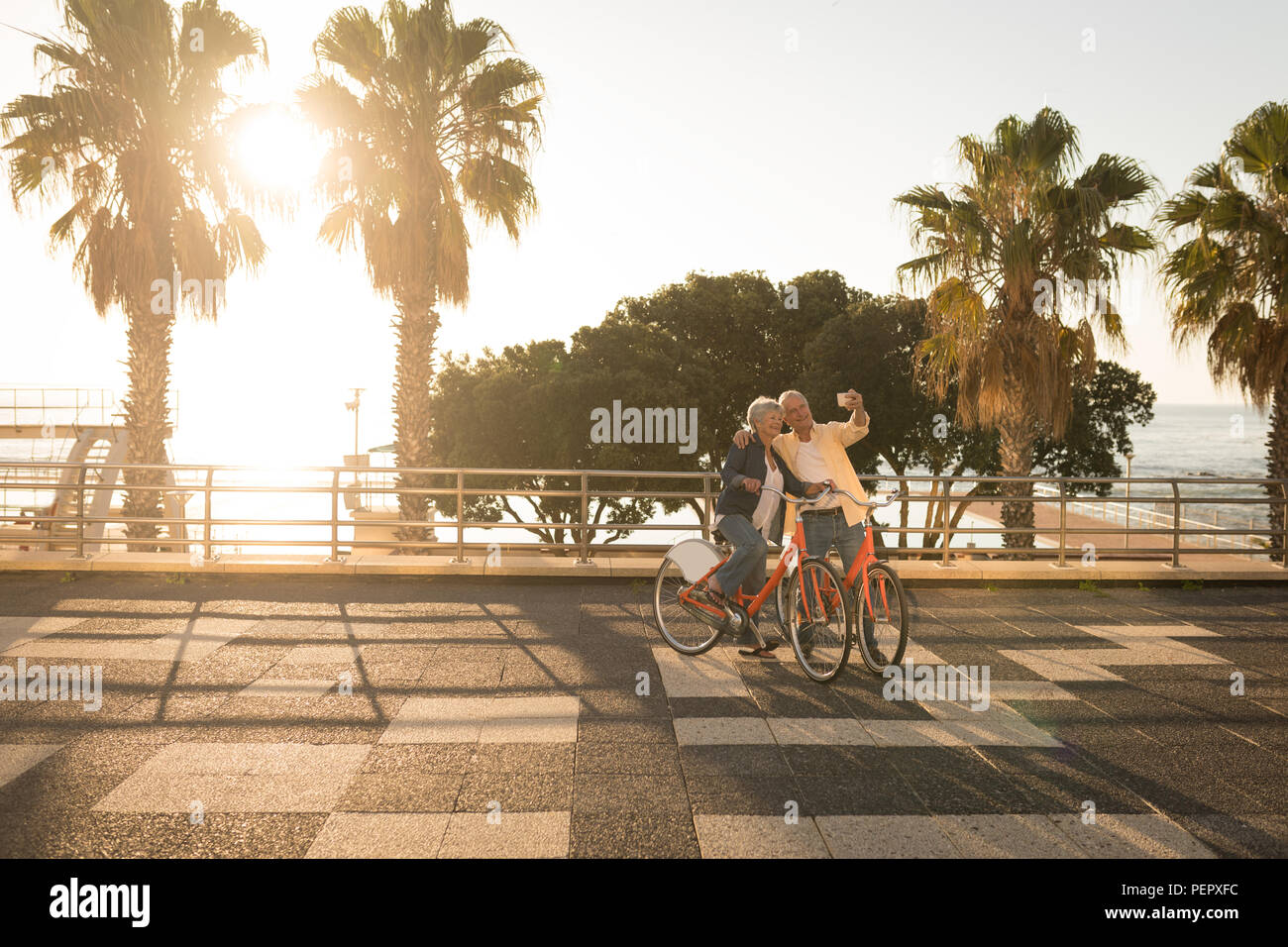 Senior couple taking selfie at promenade Stock Photo