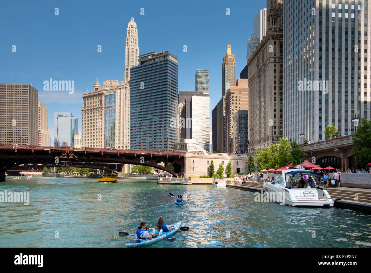 Chicago River,the Riverwalk, Kayaks and surrounding downtown architecture in summer, Chicago, Illinois, USA Stock Photo