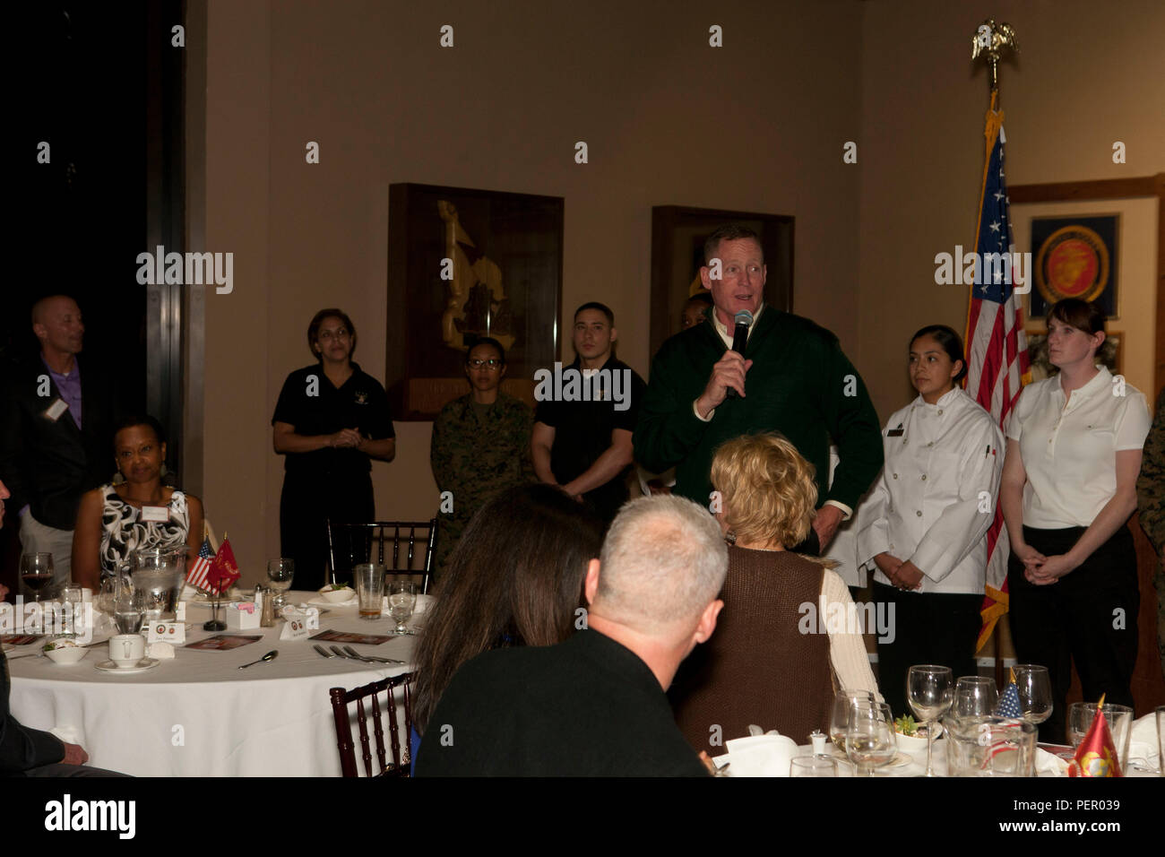 U.S. Marine Corps Brig. Gen. Edward Banta, Camp Pendleton and MCIWEST Commanding General speaks with honored guests at the conclusion of the Food Industry Feeding Heroes (FISH) dinner, at Iron Mike's lounge on Camp Pendleton, Calif., Jan 21, 2016. The event is hosted by Camp Pendleton and MCIWEST Commanding General, Brig. Gen. Edward Banta, and Mr. Paul Chapa to honor service members for their accomplishments and sacrifices. (U.S. Marine Corps photo by Cpl. Brian Bekkala/MCIWEST-MCB CamPen Combat Camera/Released) Stock Photo