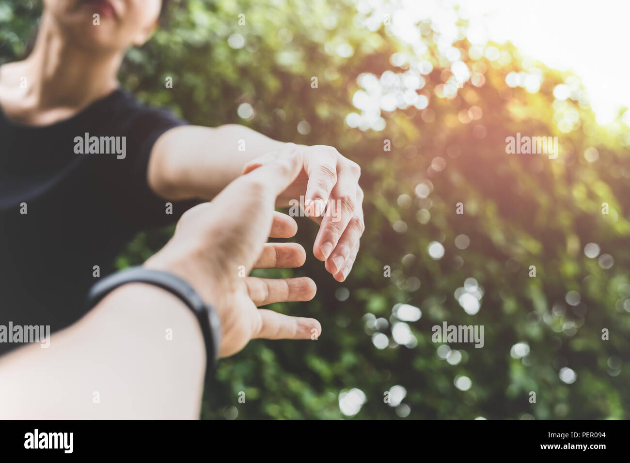 Conceptual hand reach out for help with light fare in matte color Stock  Photo - Alamy
