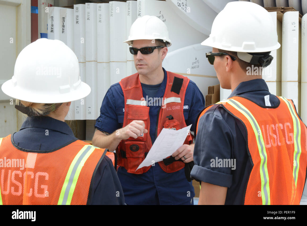 A Coast Guard marine science technician and instructor conducts ...