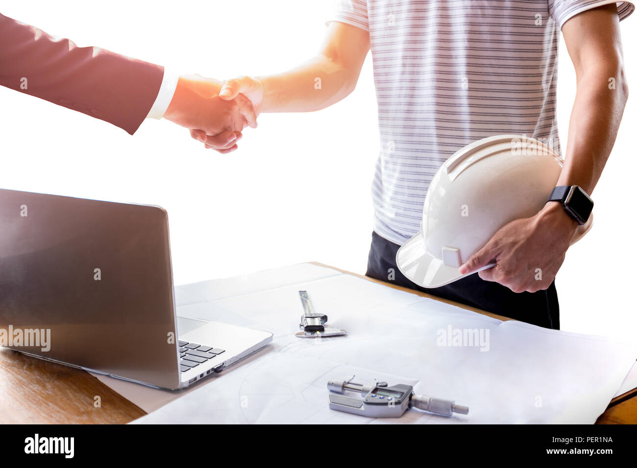 Businessman and Architect engineer shaking hands teamwork success ...