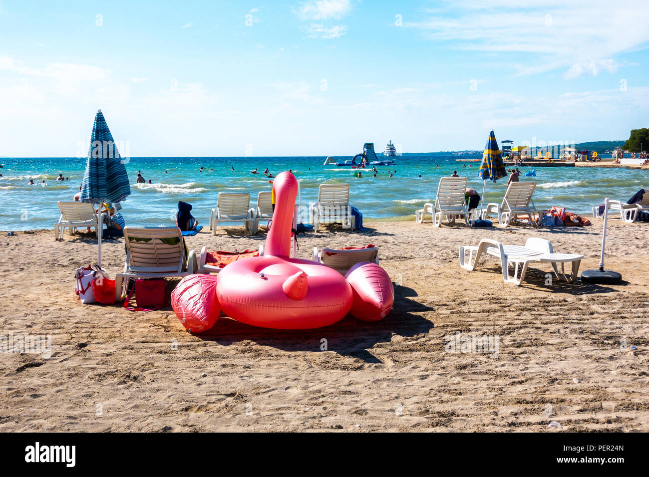 Floatie Flamingo on Luxury sand beach in Borik, Zadar Croatia Stock Photo