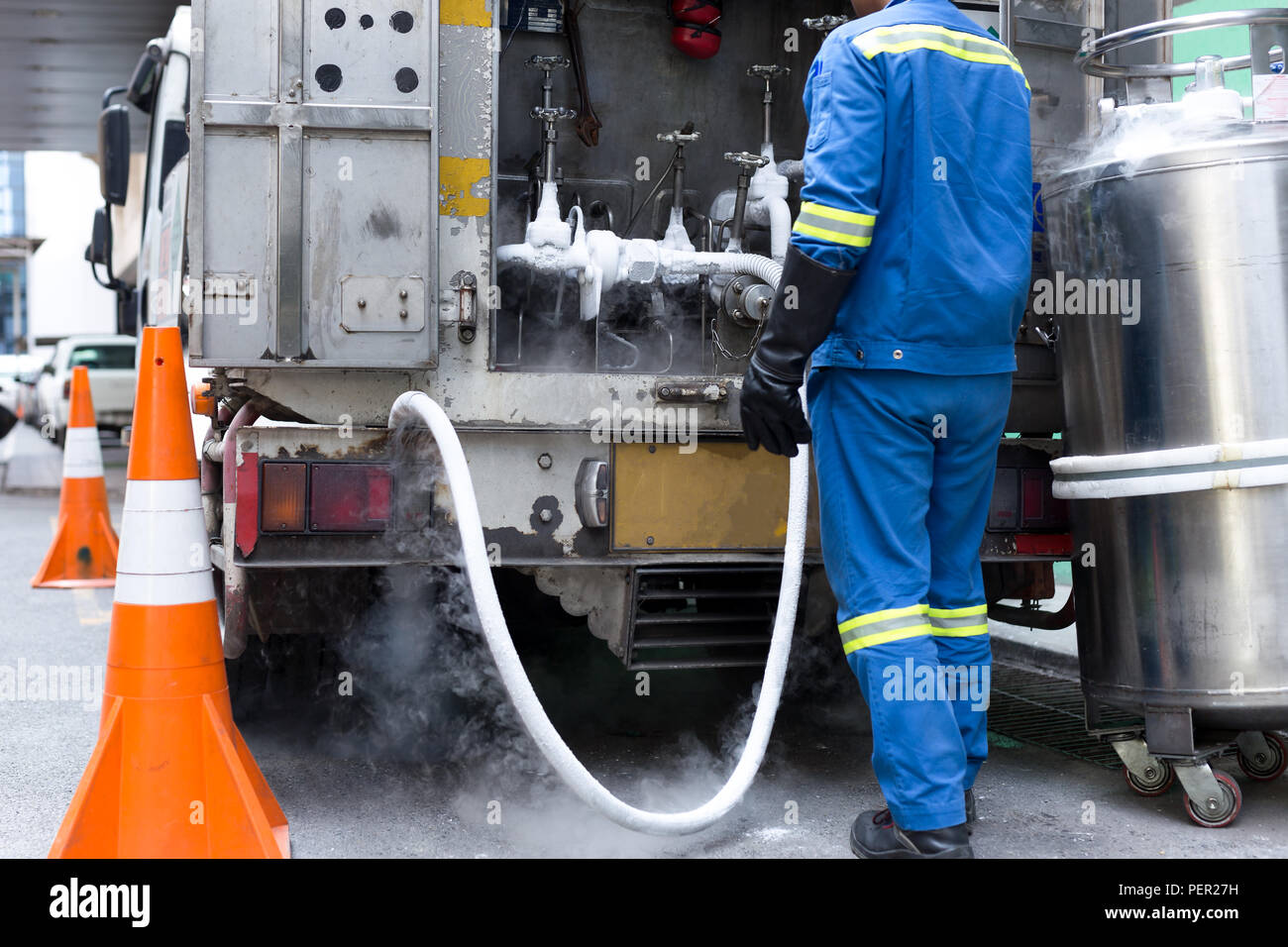 Technician fill with liquid nitrogen with Nitrogen storage tank from a van. Stock Photo