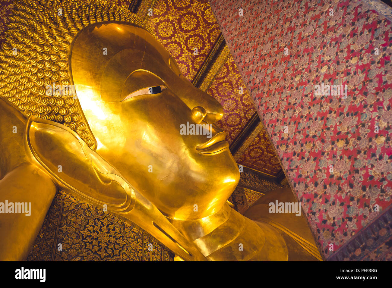 big golden buddha head in Wat Pho buddhist temple in Bangkok , Thailand Stock Photo
