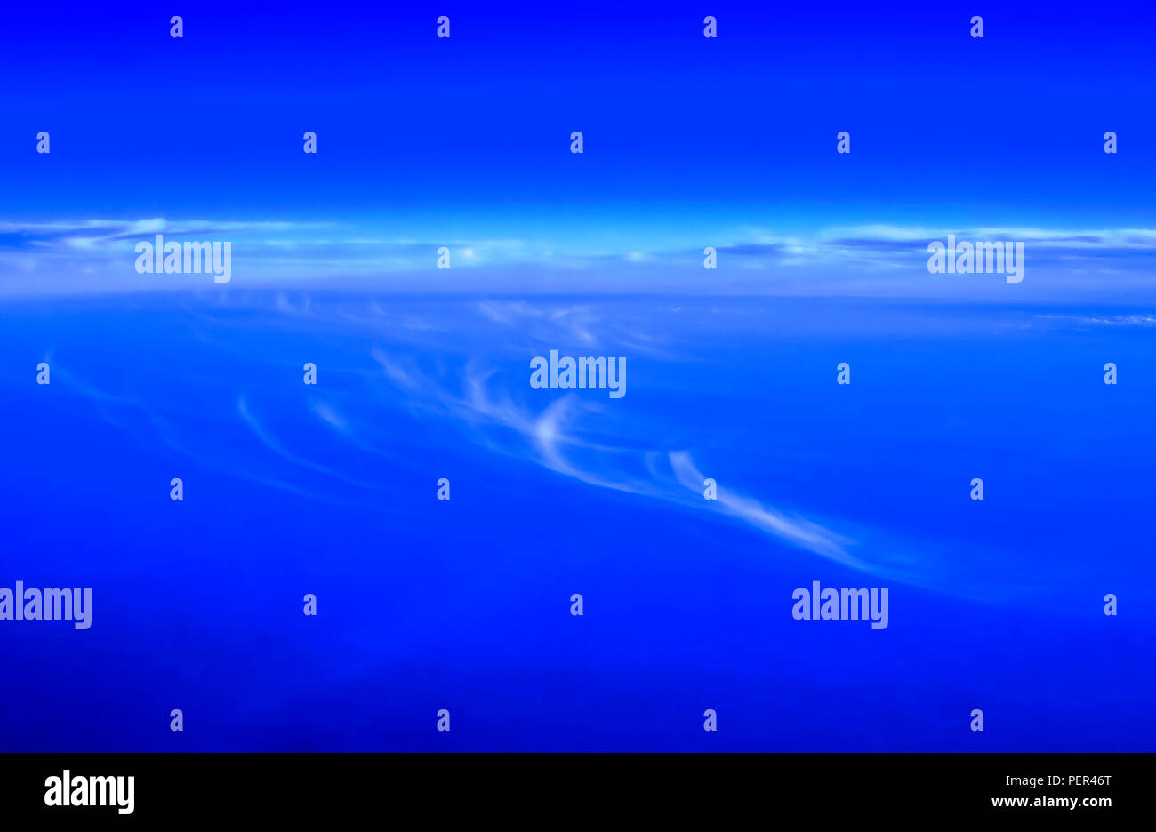 Dark unnatural blue sky with designed type clouds Stock Photo - Alamy