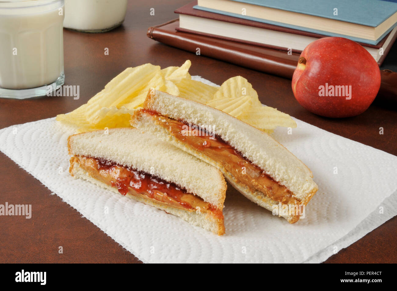 A peanut butter and jelly sandwich with school books Stock Photo Alamy