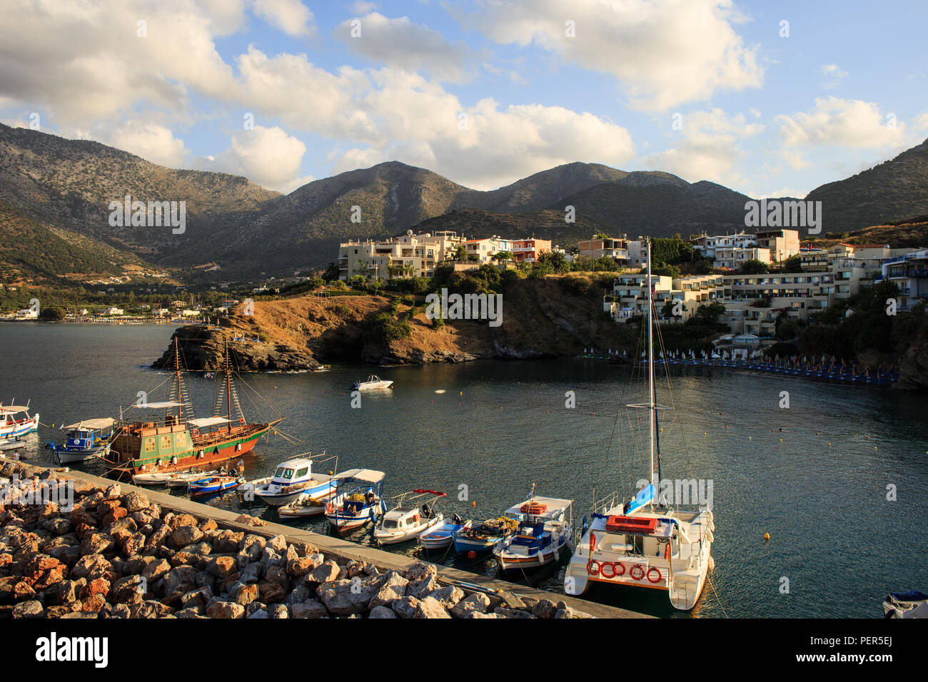 Harbour with marine vessels, boats. Panoramic view from a cliff on a Bay Bali Crete, Greece Stock Photo