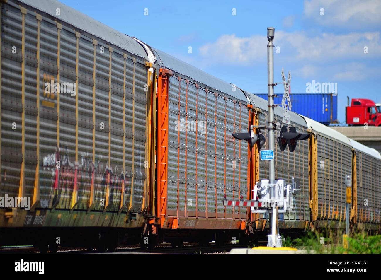 Rochelle, Illinois, USA. An easbound Union Pacific auto rack freight train moving through a grade crossing during its journey to Chicago. Stock Photo