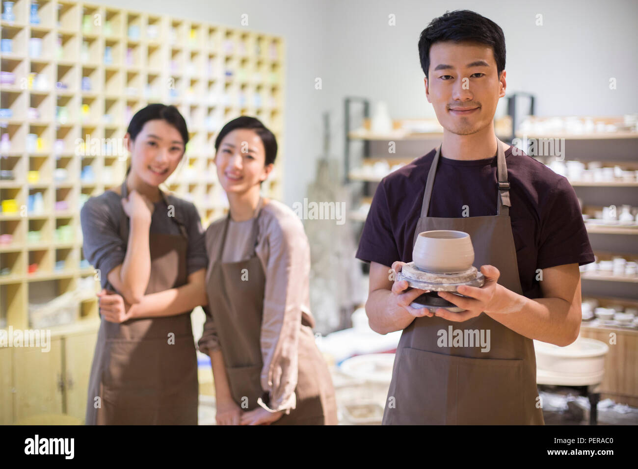 Young potters working in pottery studio Stock Photo - Alamy
