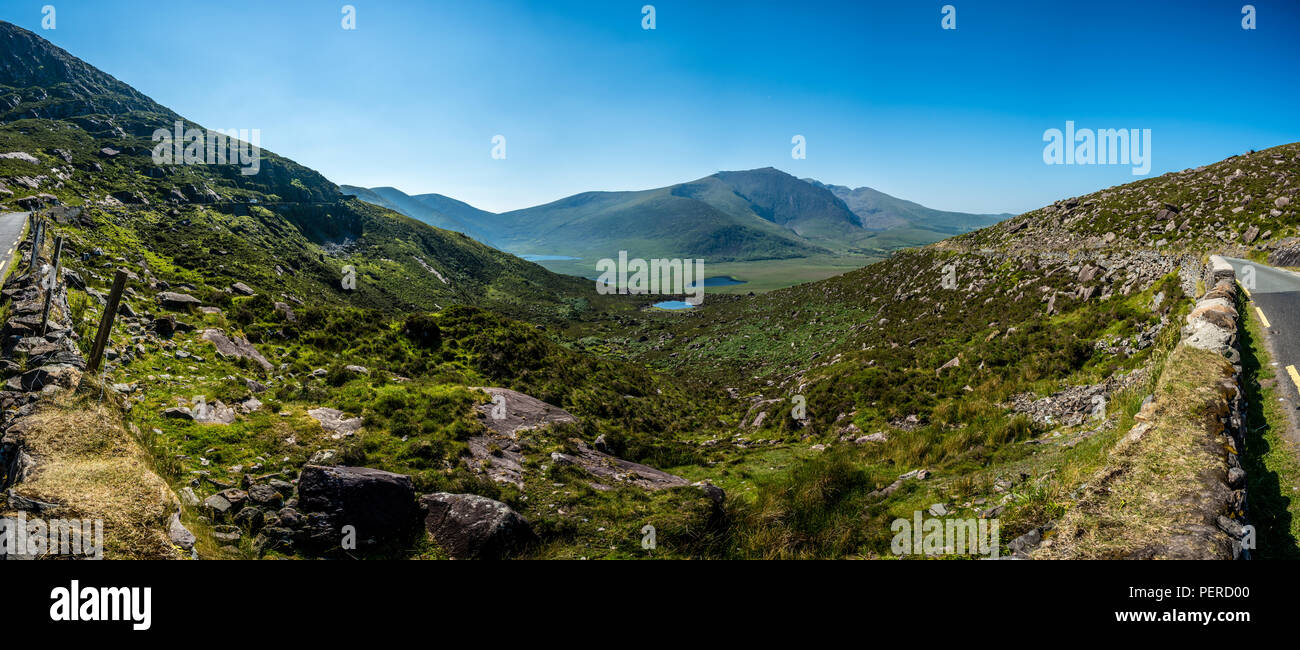 Panorama of the Irish countryside of the western coast with lakes and pastures. Stock Photo