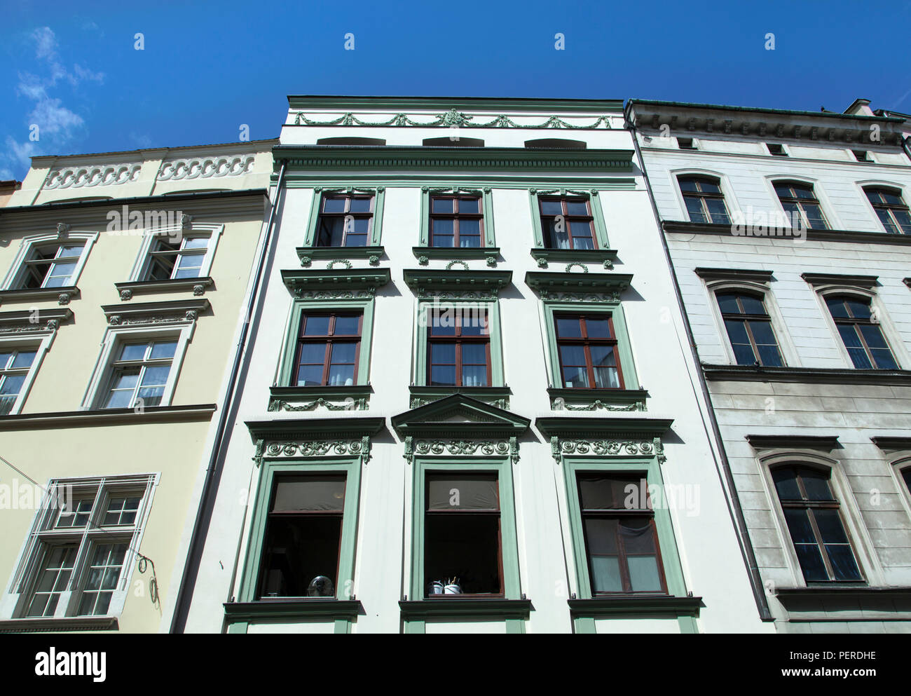 Open windows of narrow buildings in Krakow old town (Poland Stock Photo ...