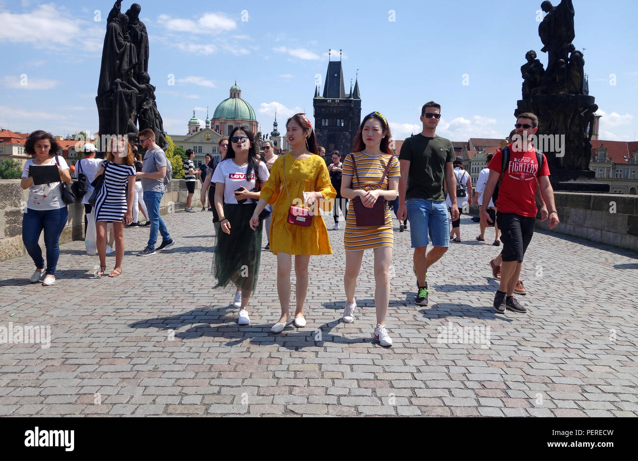 Tourists walking on across on The Charles Bridge, Prague, Czech Republic Stock Photo