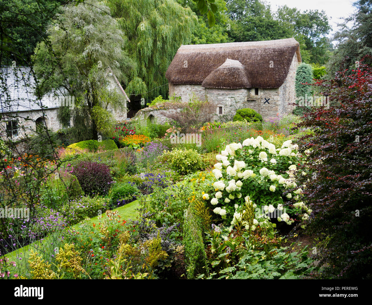 August view over the lower terrace of the walled garden at The Garden House, Buckland Monachorum, Devon, UK Stock Photo
