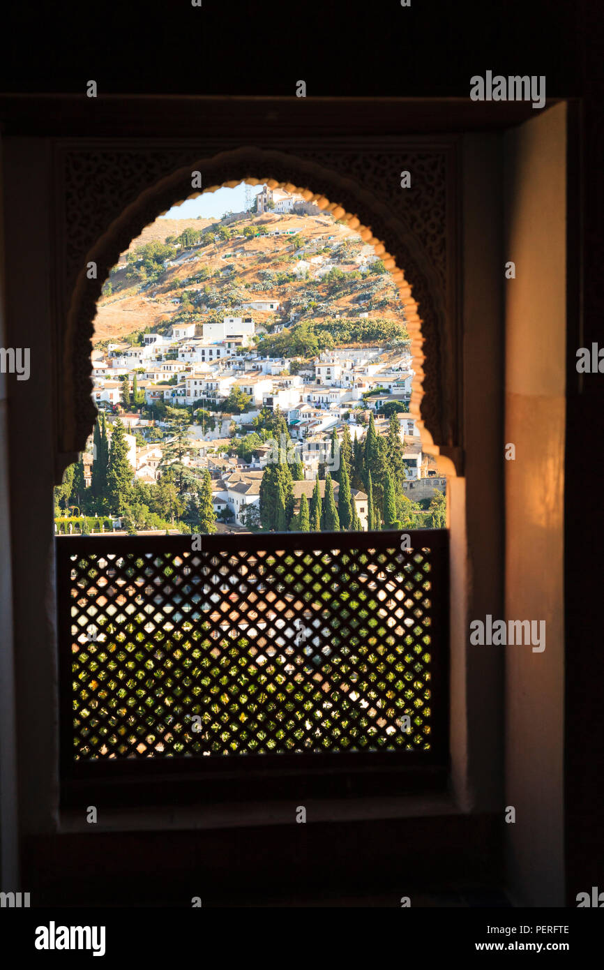Decorative Moorish Architecture window looking out on hillside village Stock Photo