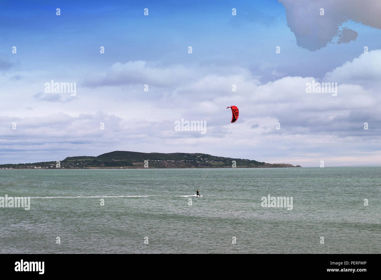 Dublin, Ireland, 15/08/2018. kite surfing in Dublin Bay, opposite Dollymount strand with Howth Head in the background. Stock Photo