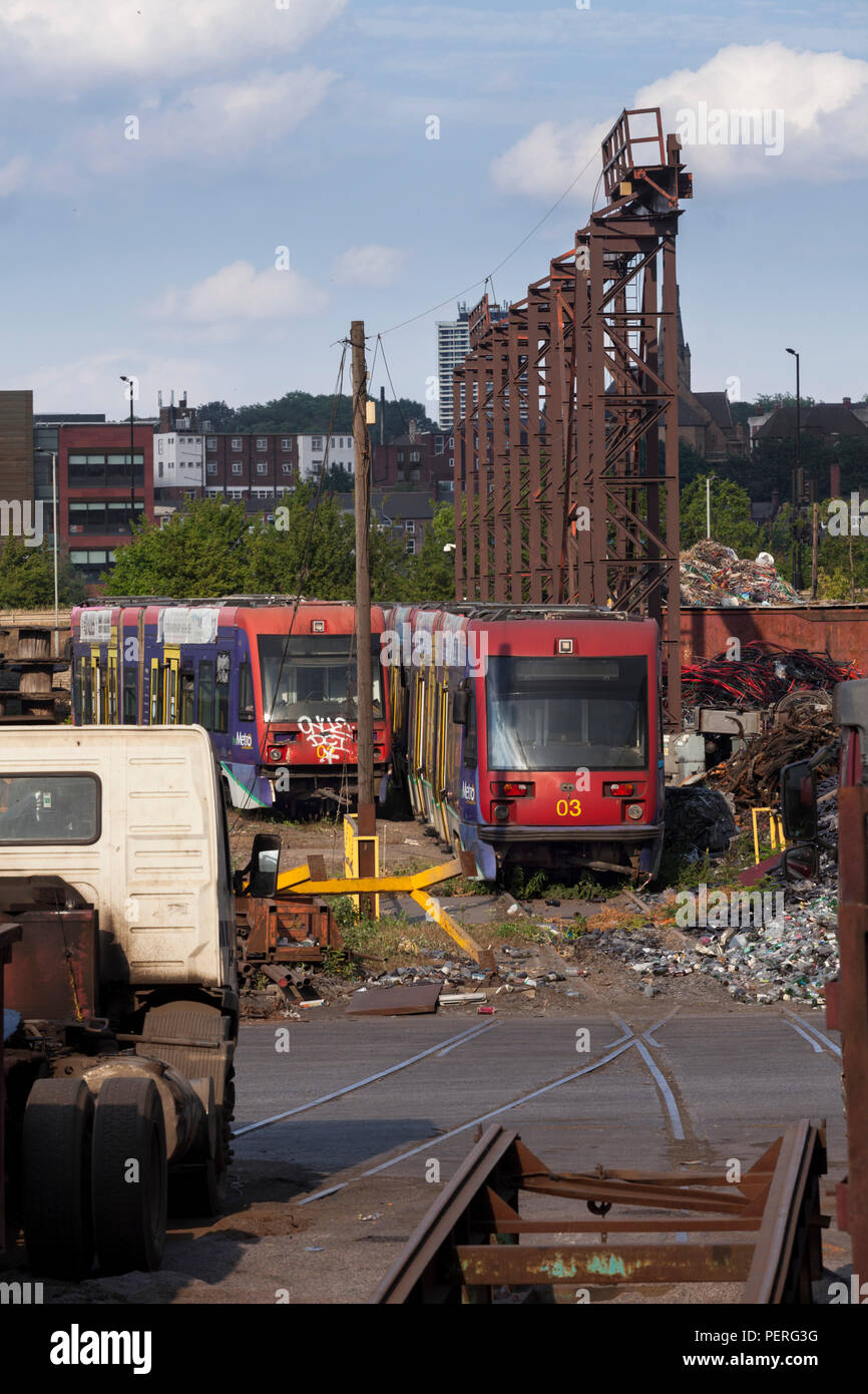 CF Booth scrapyard, Rotherham Former Midland Metro trams 02 (L) 03 (R) amongst others awaiting scrapping. Stock Photo