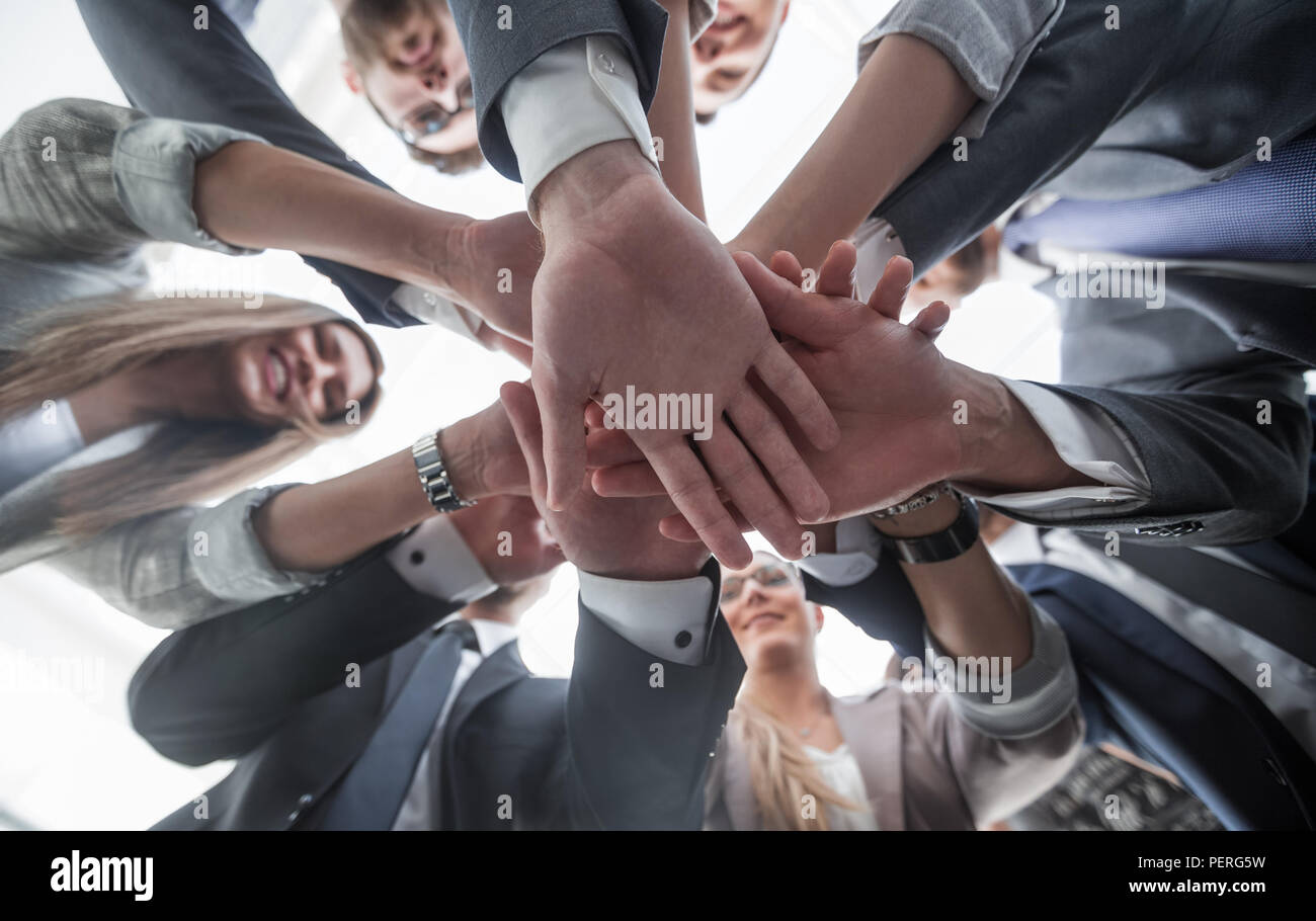 bottom view.the business team shows its unity Stock Photo - Alamy