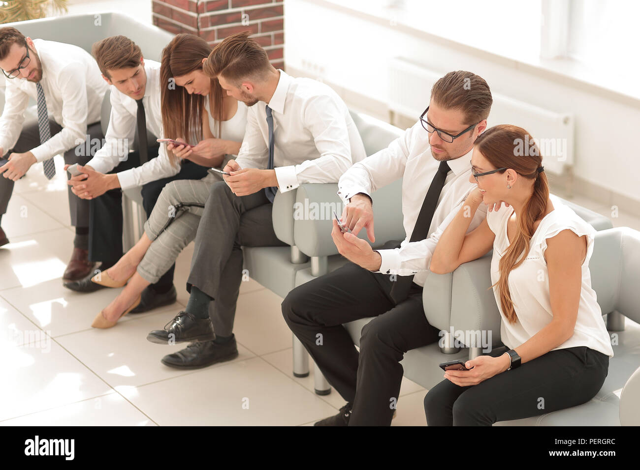 business team sitting in the lobby of the business cente Stock Photo ...