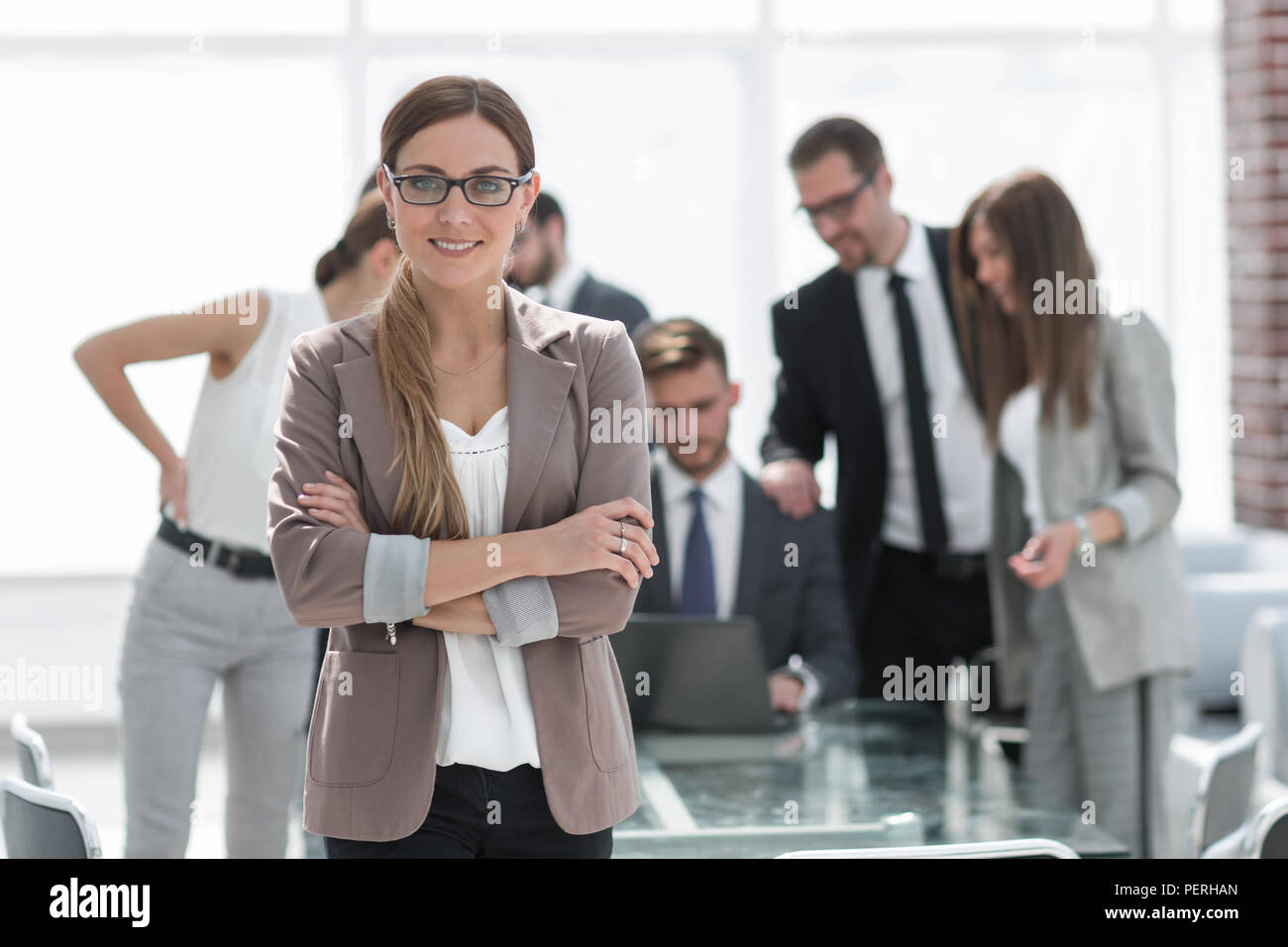 portrait of modern business woman on office background Stock Photo - Alamy