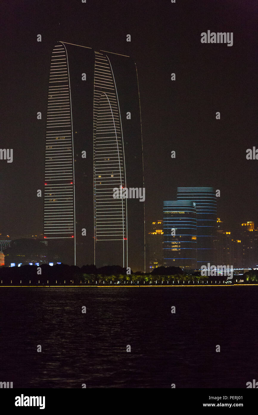 Suzhou, Jiangsu, China.  'Gate of the Orient' Office Building seen from Li Gong Dike at Night. Stock Photo