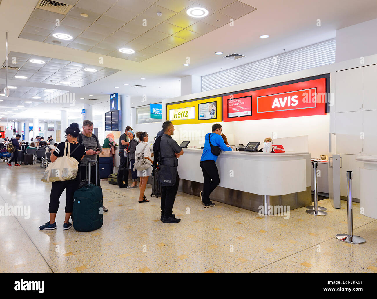 People queuing up at Car Rentals desks at Sydney Airport, New South Wales, NSW, Australia Stock Photo
