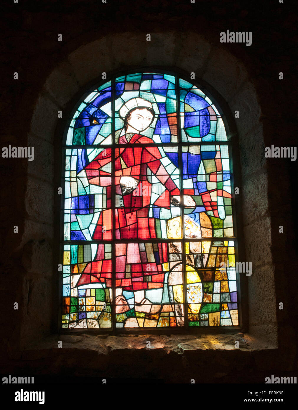 Stained glass window in 12th century church near Chateau d'Etoges in