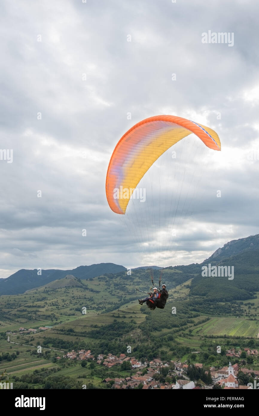 Paratroopers in the air in the countryside, Romania Stock Photo