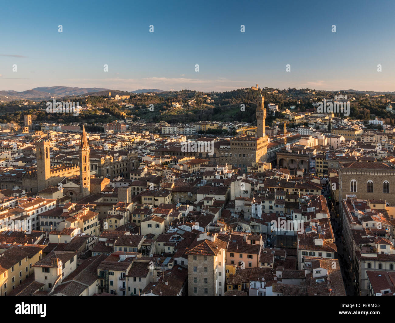 Florence, Italy - March 23, 2018: Evening light illuminates the cityscape of Florence, including the towers of the Bargello and Palazzo Vecchio, with  Stock Photo