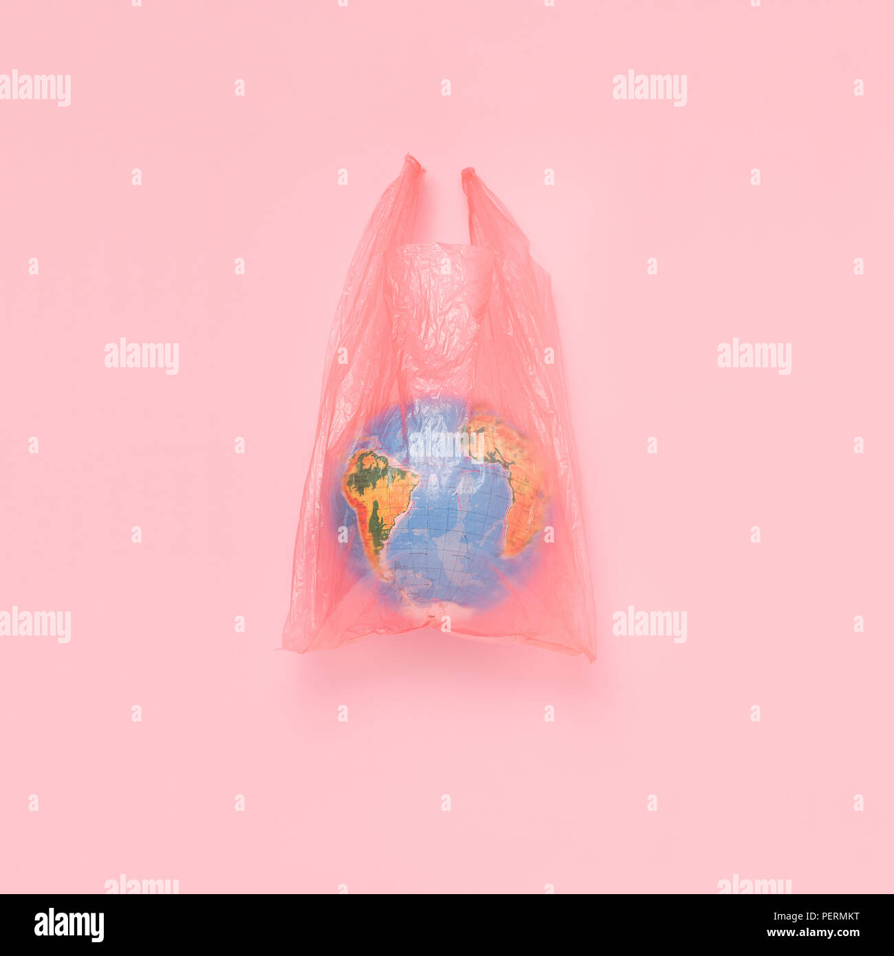 The globe in a plastic bag, the concept of global pollution Stock Photo
