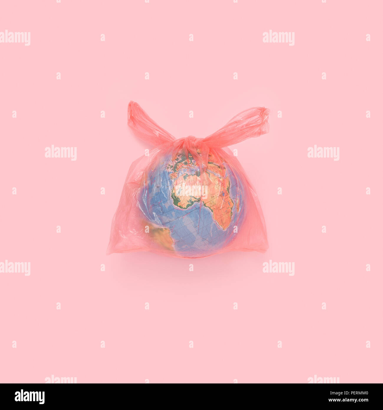 The globe in a plastic bag, the concept of global pollution Stock Photo