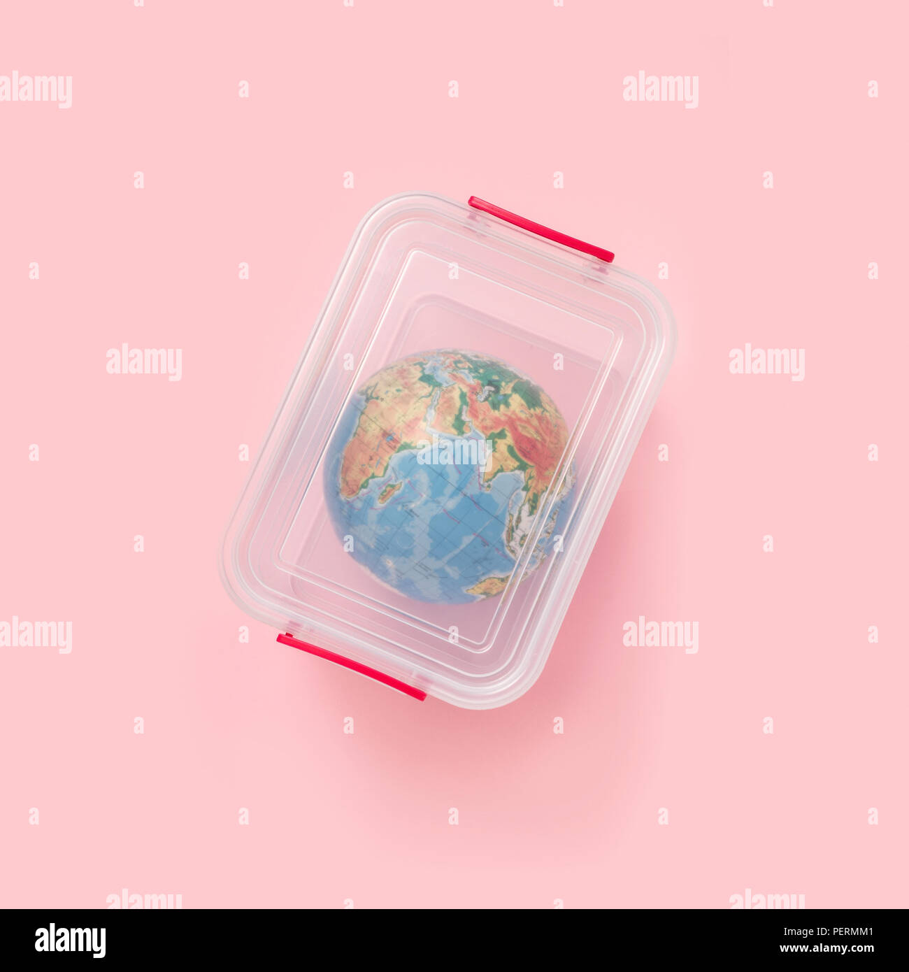 The globe in a plastic box, the concept of global pollution Stock Photo
