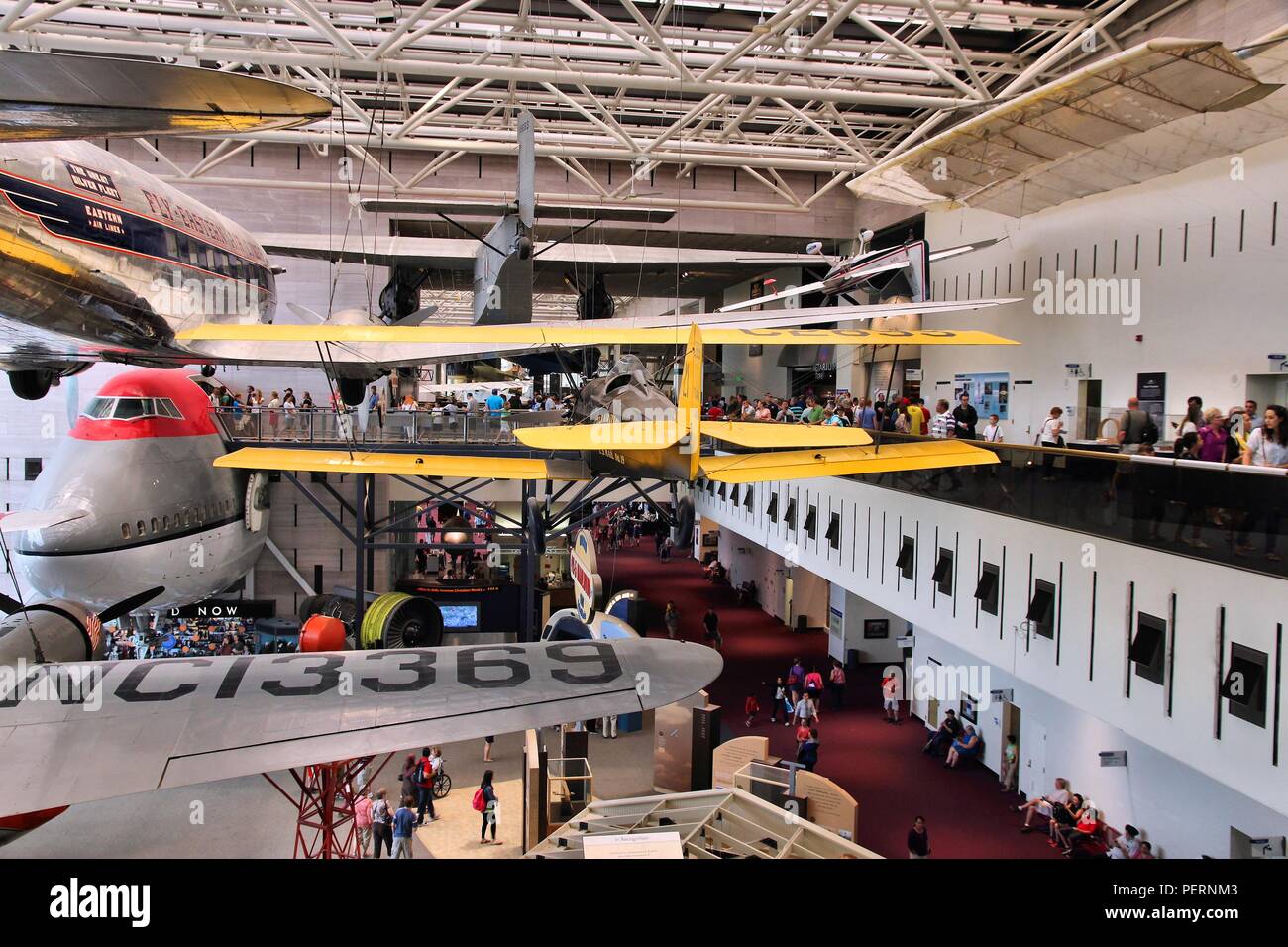 WASHINGTON - JUNE 13: People visit Smithsonian National Air and Space Museum on June 13, 2013 in Washington. It holds the largest collection of histor Stock Photo