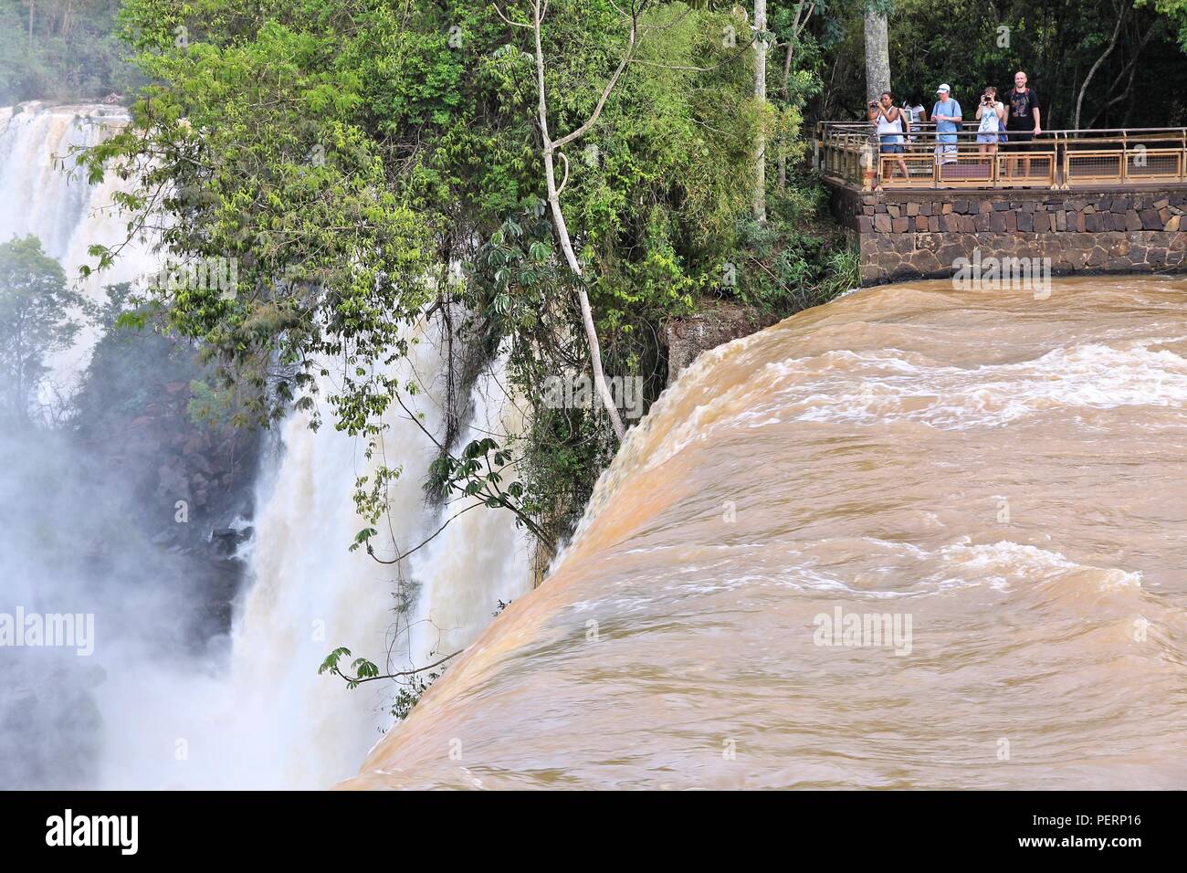 IGUAZU NATIONAL PARK, ARGENTINA - OCTOBER 10, 2014: People visit Iguazu National Park in Argentina. The park was established in 1934 and is a UNESCO W Stock Photo