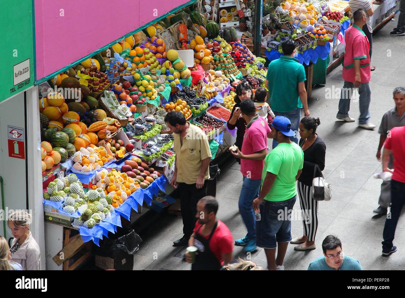 SAO PAULO, BRAZIL - OCTOBER 6, 2014: People visit Municipal Market in Sao Paulo. The market was opened in 1933 and currently sells about 350 tons of f Stock Photo