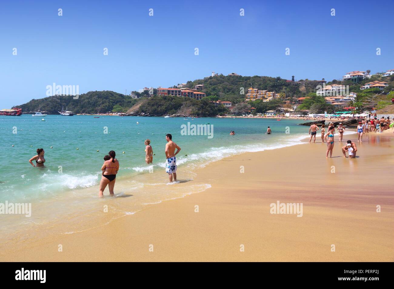 BUZIOS, BRAZIL - OCTOBER 16, 2014: People visit Joao Fernando beach in Buzios, state of Rio de Janeiro in Brazil. Brazil had 5.17 million visitors in  Stock Photo