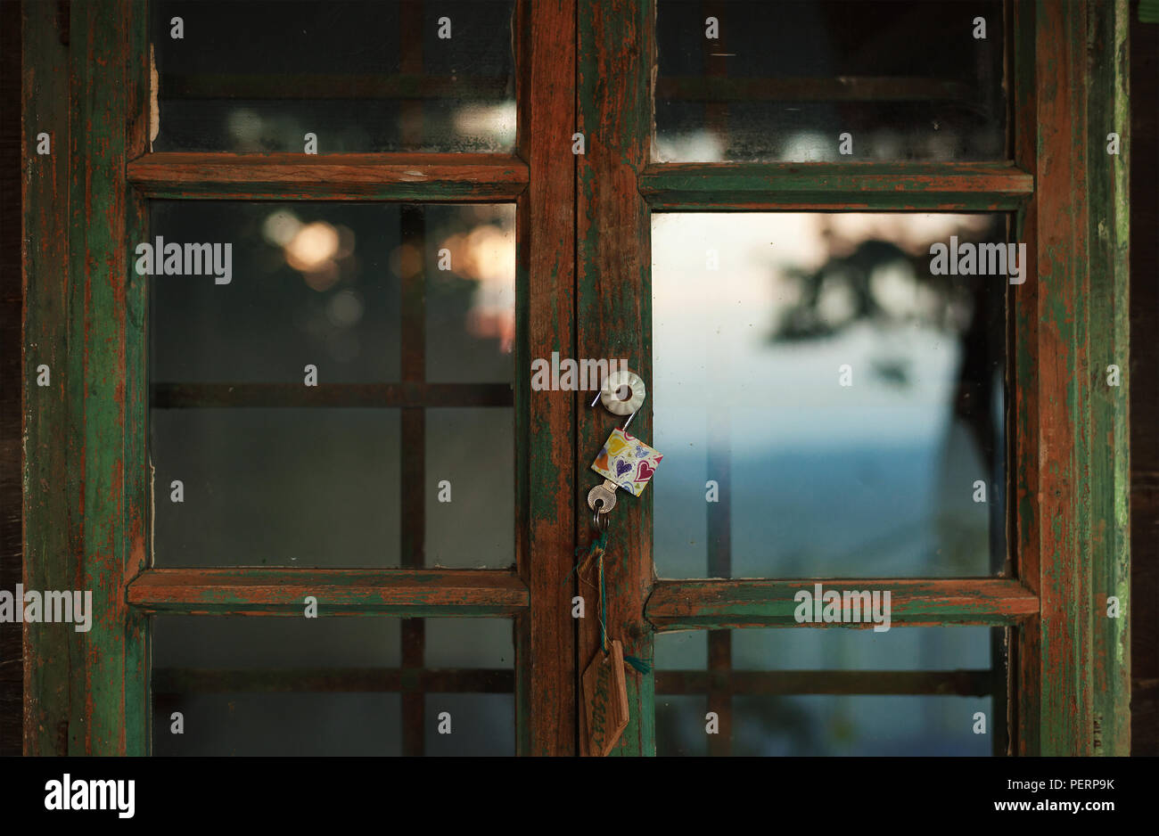 Closeup view of an old vintage style wooden window, exterior details of an old wooden cottage. Stock Photo