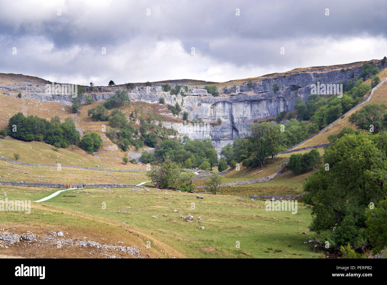Malham Cove in the Yorkshire Dales was created at the end of the last Ice Age by a waterfall carrying meltwater from glaciers. Stock Photo