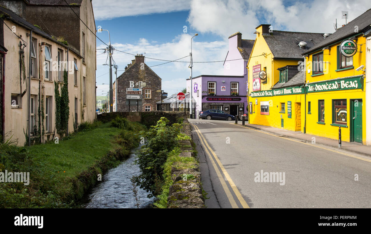 Dingle, Ireland - September 13, 2016: Brightly coloured pubs and buildings in the centre of the small tourist town of Dingle. Stock Photo