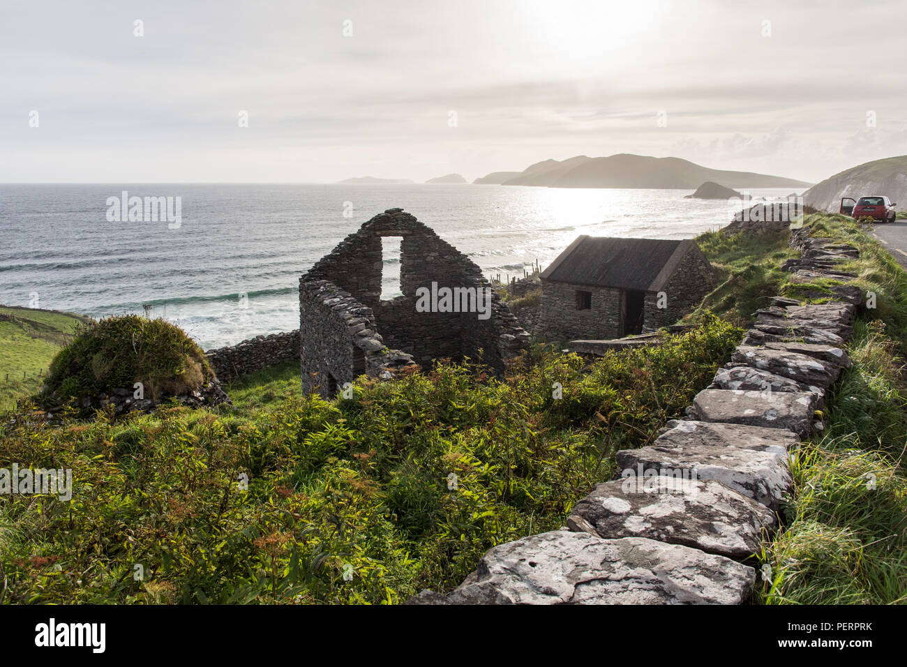 Ruined clifftop farm buildings at Slea Head on Dingle Peninsula in the west of Ireland's Dingle Peninsula. Stock Photo