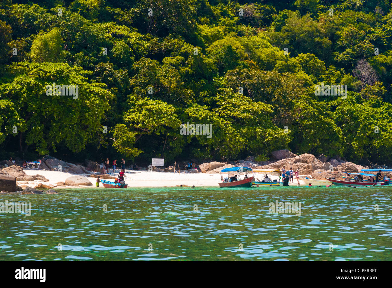 Surrounded by rocks and forest, Rawa beach with its fine sand and clear water is one of the best within the Perhentian archipelago. Only accessible by... Stock Photo