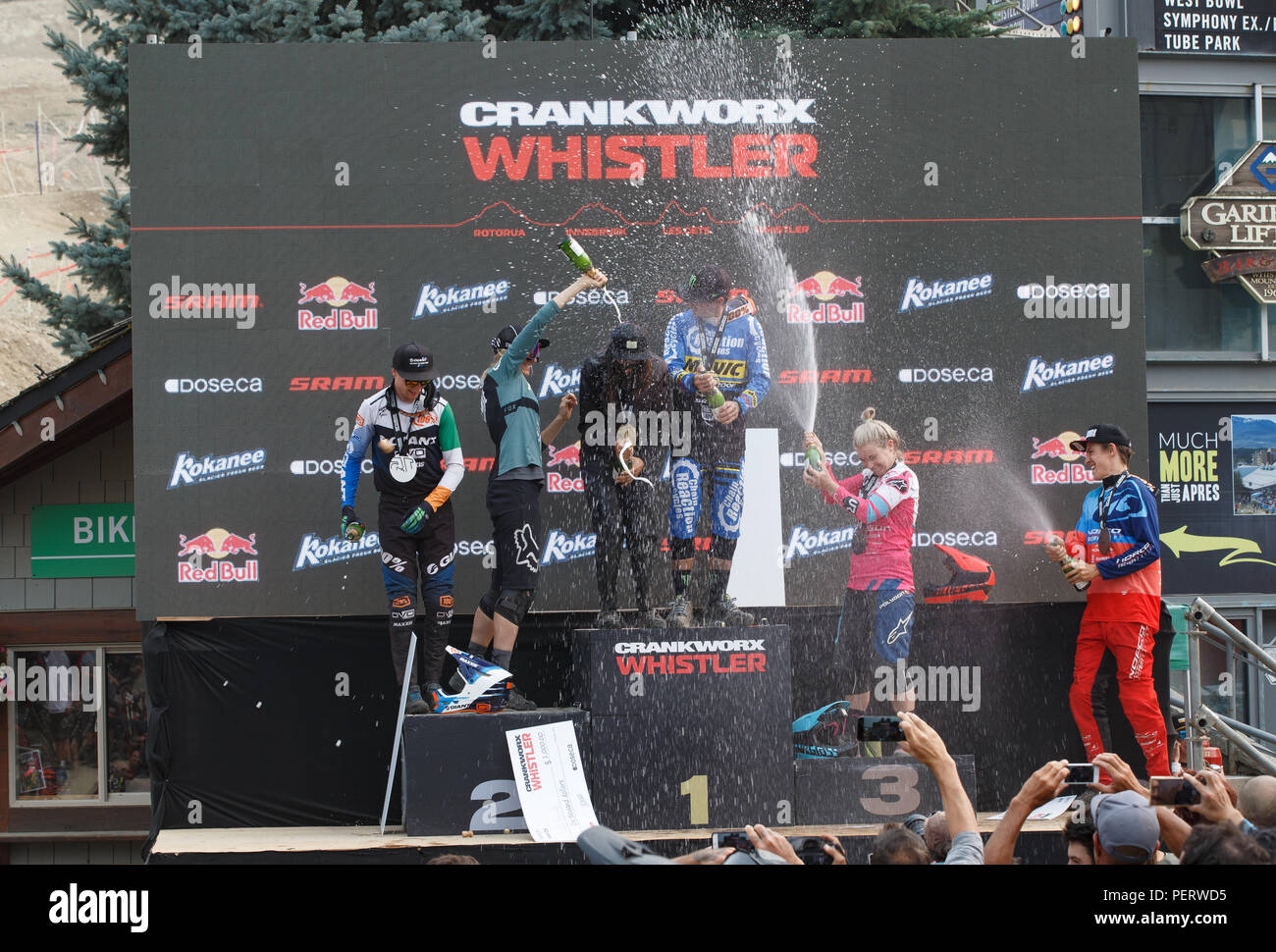 Winner's podium champagne celebration at the Crankworx Garbanzo DH event, Whistler, BC, Canada. Stock Photo