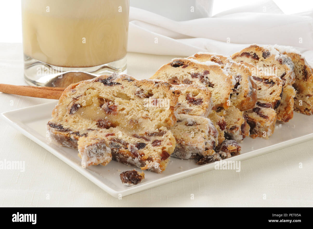 Stollen, a traditional German Christmas fruit cake with egg nog Stock