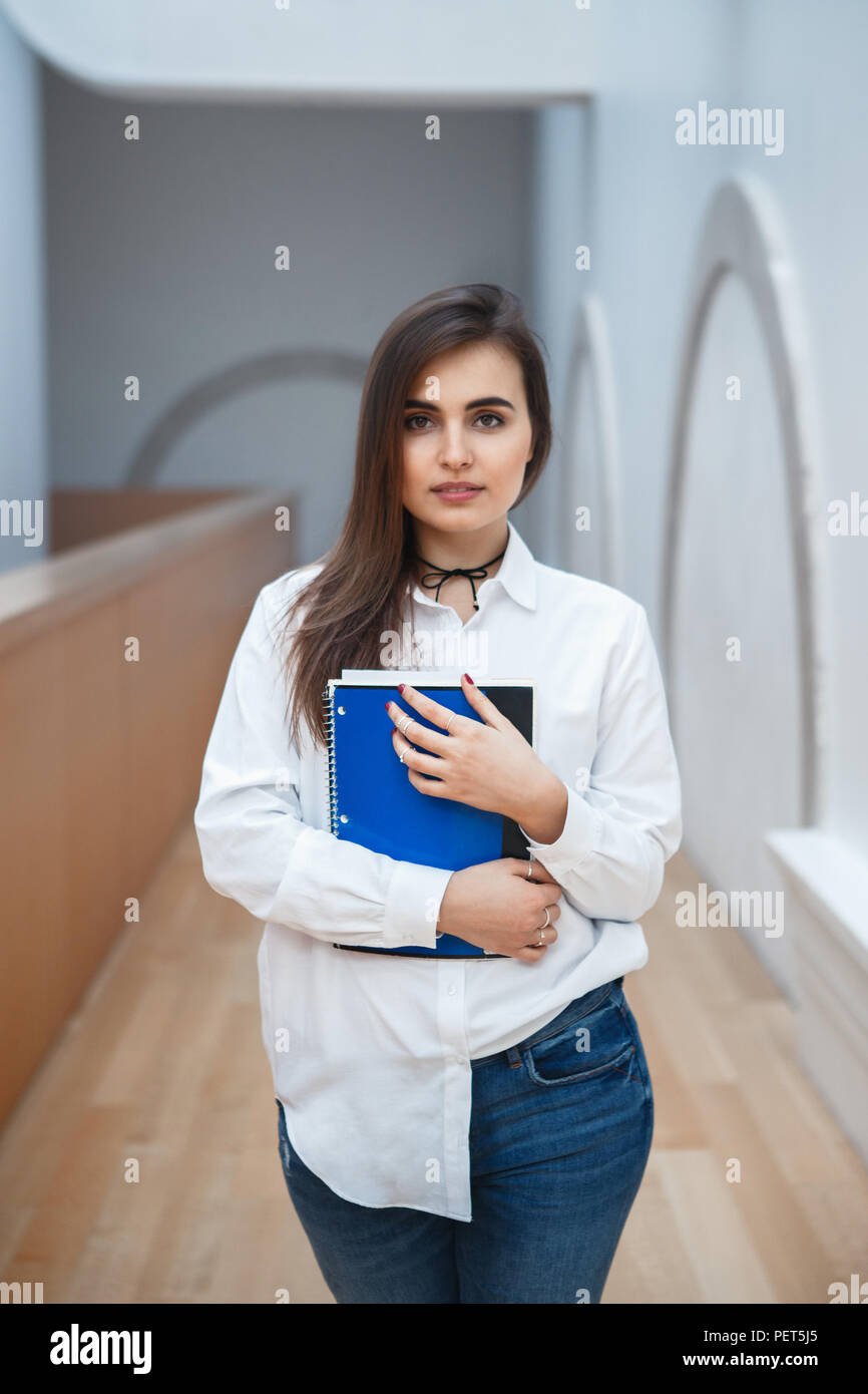 Student long hair in jeans hi-res stock photography and images - Page 3 -  Alamy