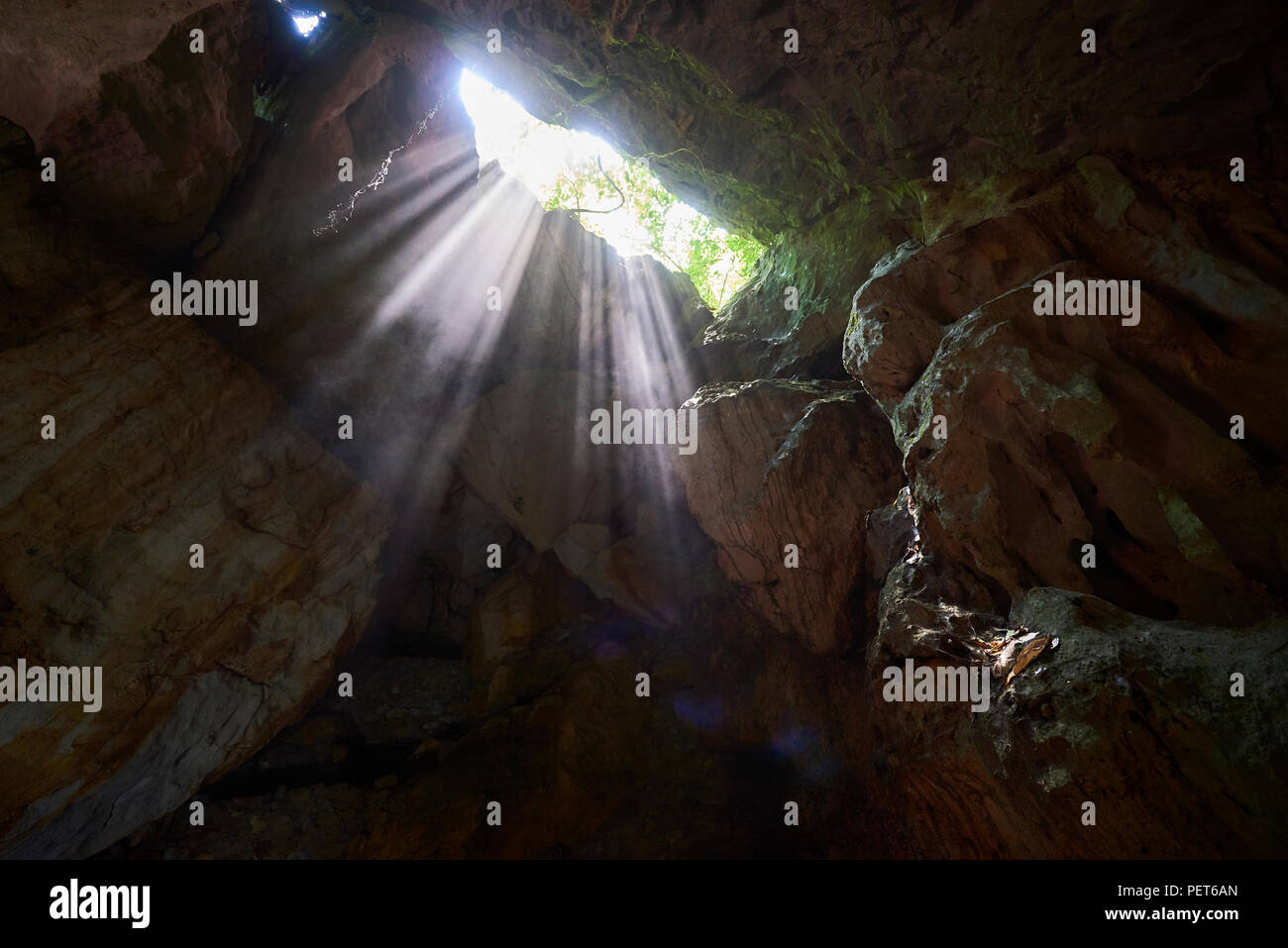 A shaft of light at the entrance of Dong Thien Duong cave, also known as Paradise Cave, in Phong Nha National Park, North-Central Vietnam. The area ha Stock Photo