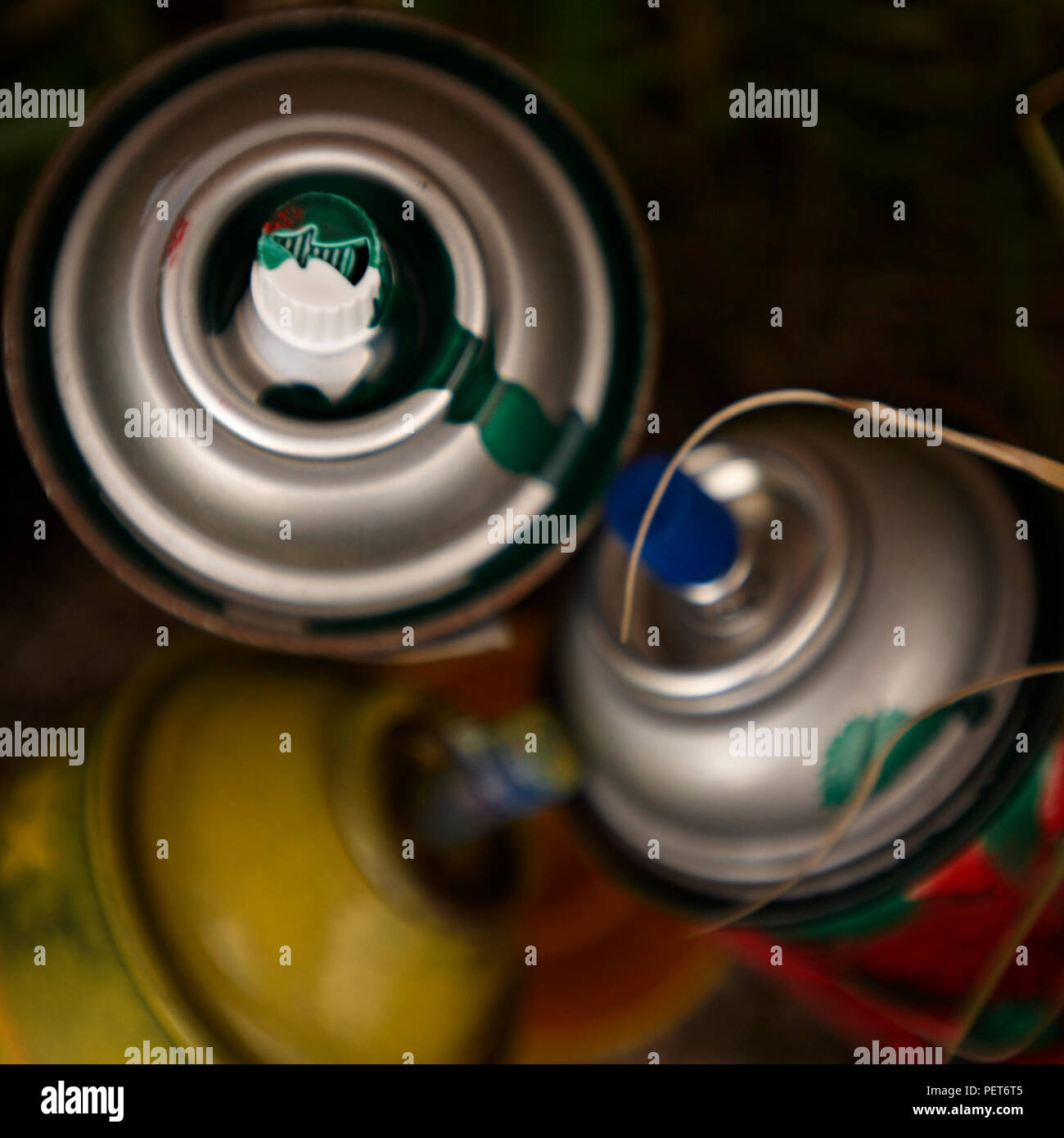 Graffiti spray paint cans used and discarded Stock Photo - Alamy