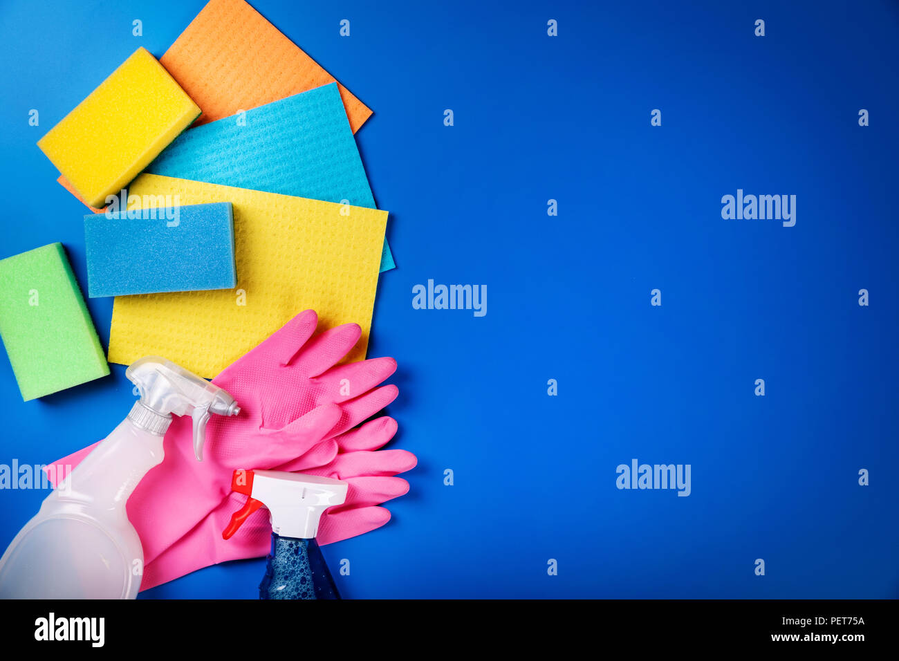 cleaning equipment on blue background with copy space Stock Photo