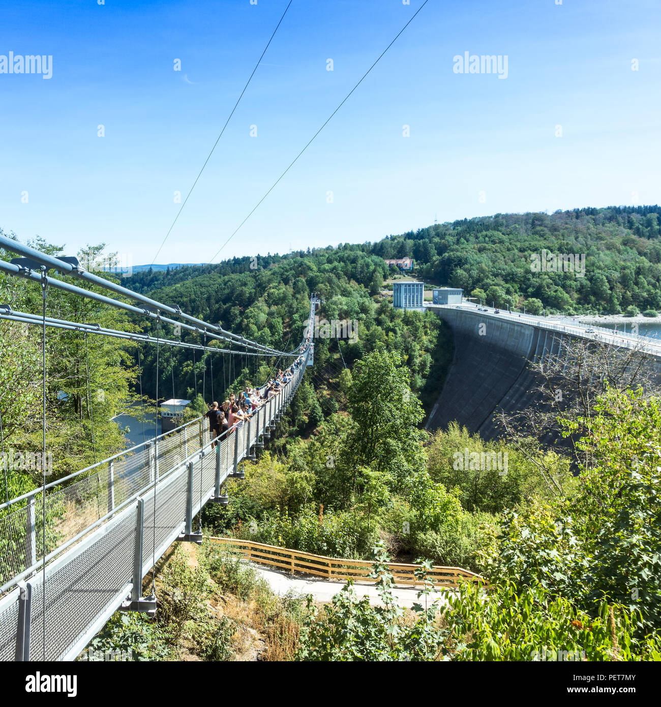 Oberharz, Saxony-Anhalt, Germany, August 12, 2018: View to the Titan suspension bridge over the Rappbode valley, with the dam of the Rappbode dam . Stock Photo