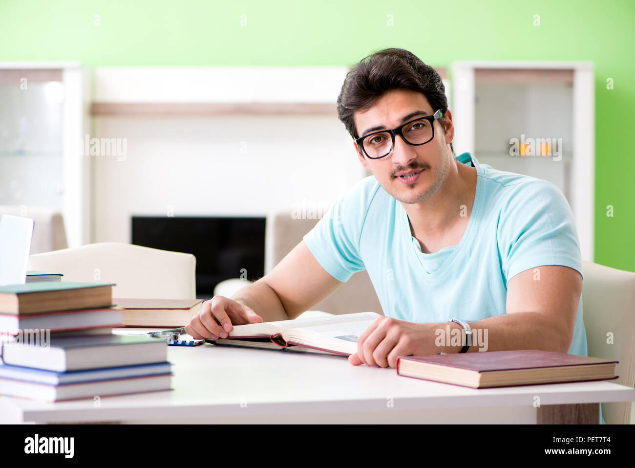 Student preparing for university exams at home Stock Photo - Alamy