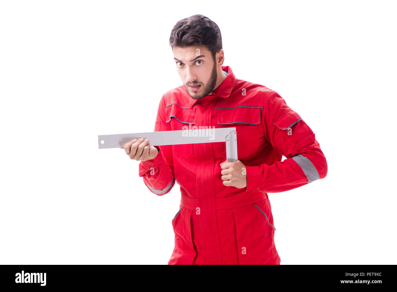 Young repairman with a square ruler isolated on white background Stock ...
